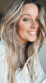 A woman with long hair and a smile.